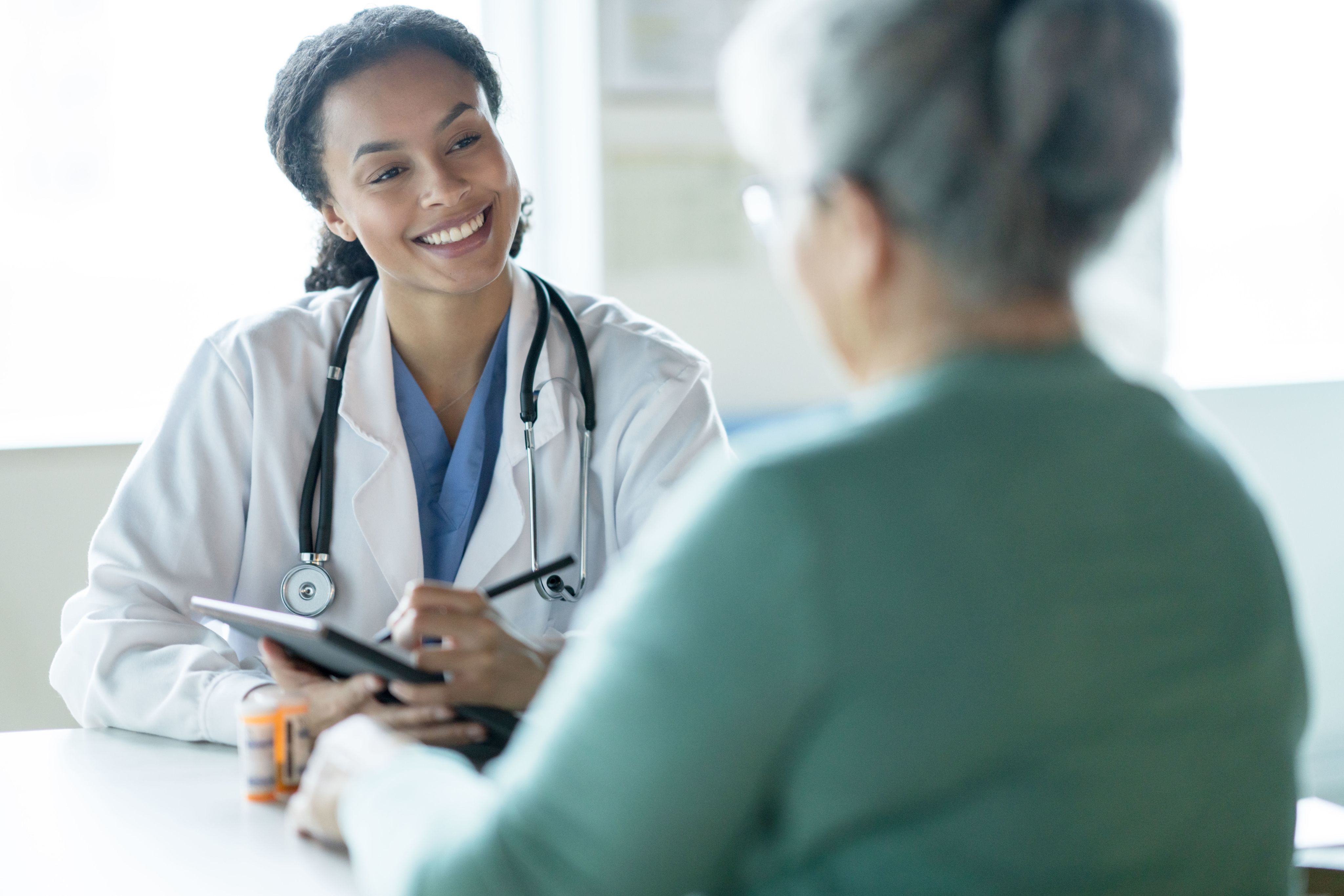 Image of a doctor explaining results to a patient.